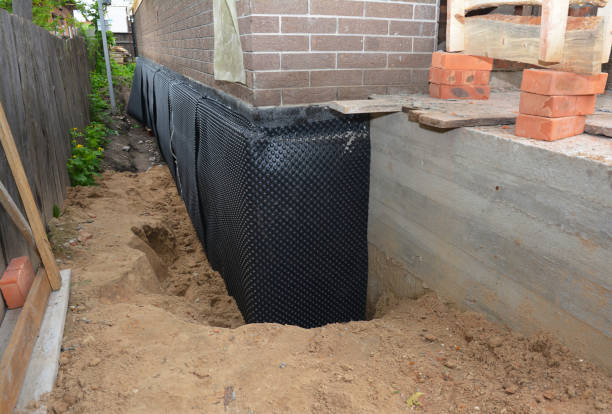Happy homeowners after waterproofing job in Clinton Township